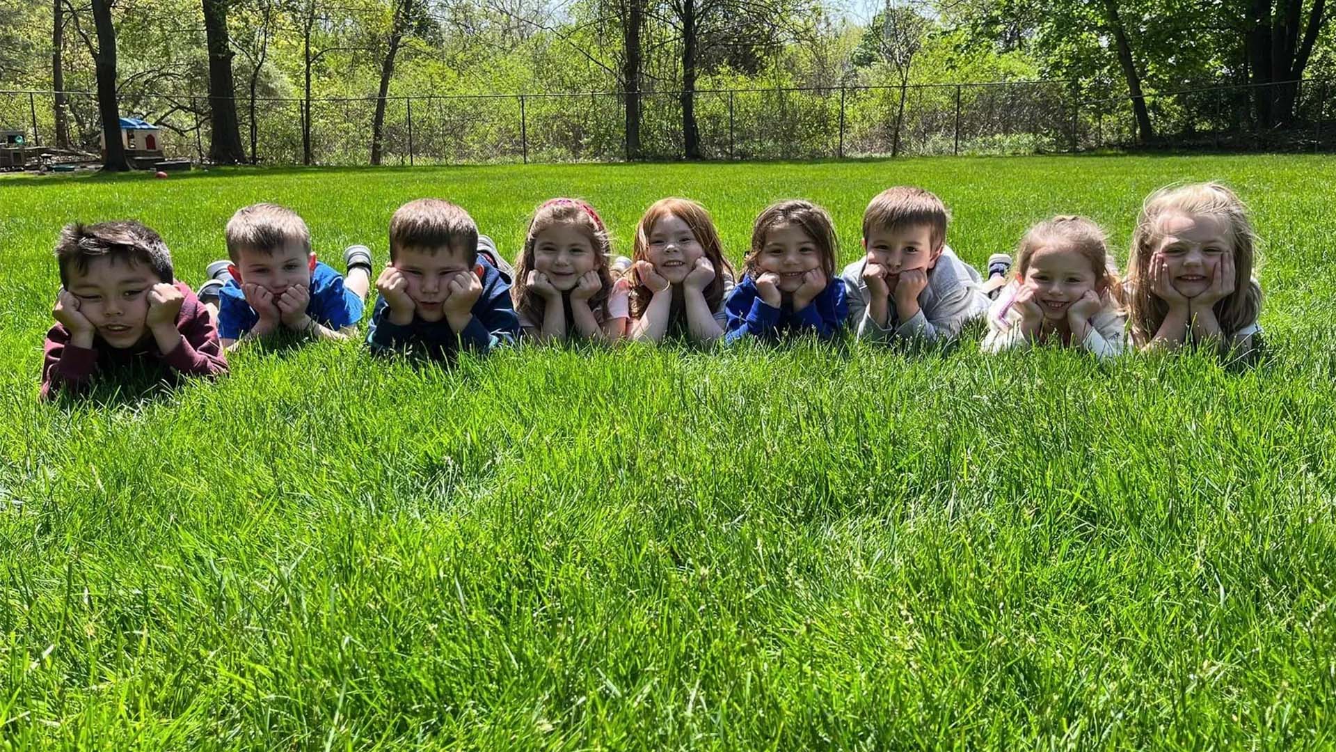toddlers on grass at Magical Beginnings Learning Center