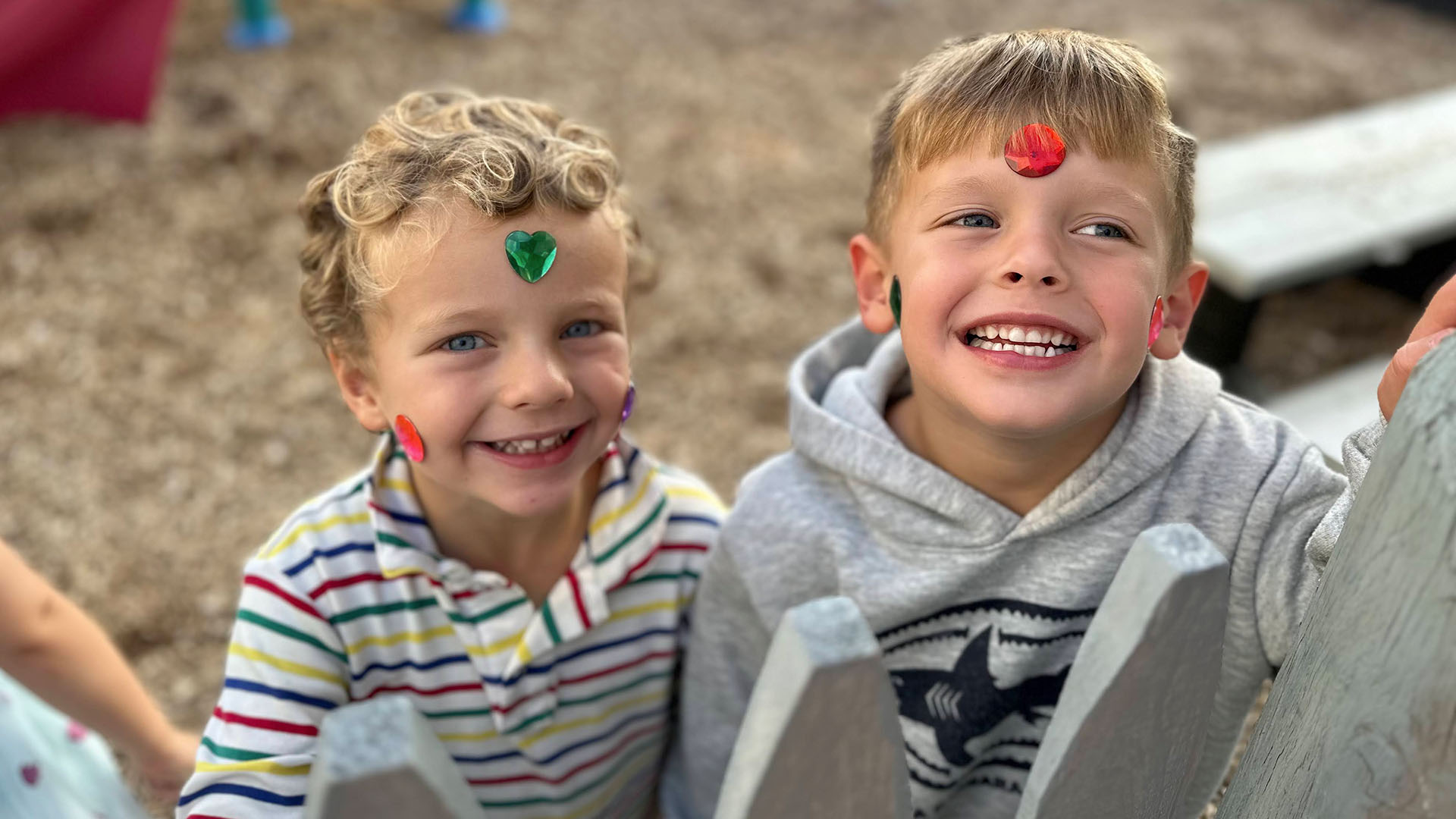 toddlers with stickers at Magical Beginnings Learning Center